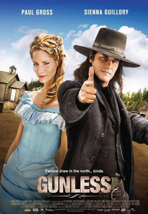 Screenshot from Gunless DVD featuring Paul Gross and Sienna Guillory in a comedy movie scene.